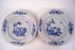 A pair of Chinese porcelain blue and white dishes, painted with flowers and butterflies, 22.