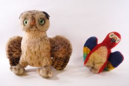 A Steiff 'Wittle the Owl' with metal button, 32cm high, and a Steiff figure of a parrot,