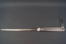 A silver engine turned combined letter-opener and steel-bladed folding knife with silver