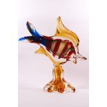 A Murano glass fish with red striped yellow and blue body, 27.