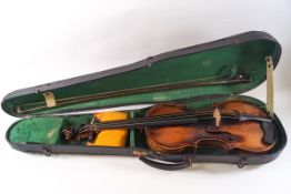 A 19th century one piece back violin, labelled Joan Kloz, Mittenwald, 14" back excluding button,