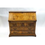 A Continental walnut bureau of unusual construction,