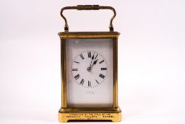 A Victorian brass presentation carriage clock, the enamel dial signed Oldfield, Liverpool,