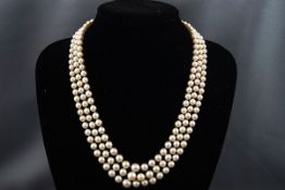 A cultured pearl three row necklace, the rows of 67, 71 & 76 beads graduated approx. 7.9mm - 4.