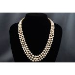 A cultured pearl three row necklace, the rows of 67, 71 & 76 beads graduated approx. 7.9mm - 4.