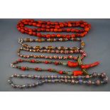 Five various bead necklaces comprising: an abstract coral,