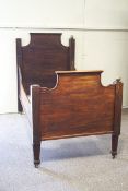 A 19th century Continental mahogany sleigh bed, mounted the brass ball finials,