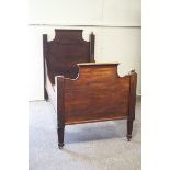 A 19th century Continental mahogany sleigh bed, mounted the brass ball finials,