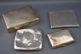 Three various silver cigarette cases and a silver mounted and part engine turned cigarette box,