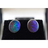 A pair of black opal oval single stone stud earrings,