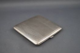 A silver engine turned square compact, Birmingham 1934, 7.5cm, 76.