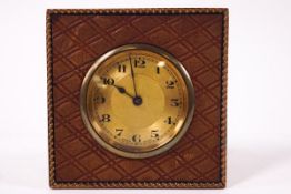 A French gilt metal and leather strut bedside clock,