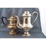 A Sheffield Plate coffee pot with ebonised handle, height 23cm and another silver plated coffee pot,