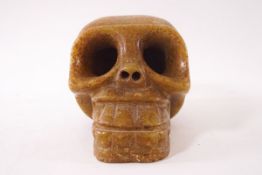 An unusual carved green hardstone skull,
