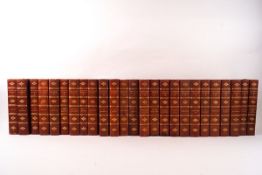 A set of twenty five Waverley novels, red leather and cloth bound,
