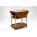 An Ercol style elm drop leaf two tier trolley,