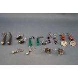 Eight pairs of silver and white metal earrings, some gem-set,