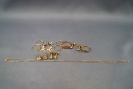 A small collection of gold and yellow metal jewellery,