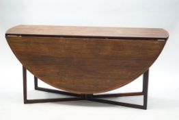 A 1960's Danish rosewood drop leaf dining table with gateleg action,