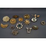 Fifteen vintage costume jewellery brooches including: a gilt metal rose; an imitation pearl circlet;