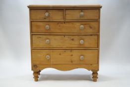 A Victorian pine chest of two short and three long drawers,