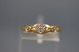An 18 carat gold single stone diamond ring set with one illusion set round brilliant cut diamond.