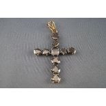 A diamond stylised Latin cross, set with ten 'fantasy-cut' brown-ish grey diamonds,