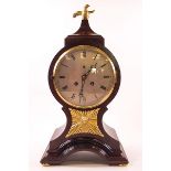 A 19th century mahogany balloon shaped mantel clock, the eight day movement with bell strike,