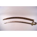 An Indian ornamental sword with brass lion and rabbit grip and hilt,