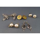 A selection of five pairs of earrings to include three pairs of silver gilt clip on,