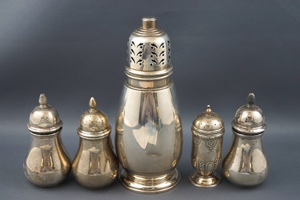 A silver composite five piece cruet set,