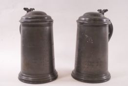 A pair of Victorian spelter tankards each with hinged coves,