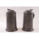 A pair of Victorian spelter tankards each with hinged coves,