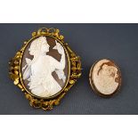 A Victorian gilt metal and shell cameo oval brooch depicting a neo classical maiden admiring