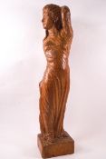 An Arts & Crafts oak carving of a woman and child, monogrammed 'P' and '84',