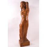An Arts & Crafts oak carving of a woman and child, monogrammed 'P' and '84',