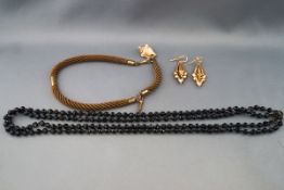 A small collection of Victorian jewellery, comprising; a woven hair watch chain/'albert,