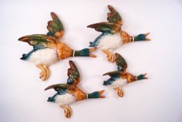 A set of four Beswick flying ducks,