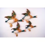 A set of four Beswick flying ducks,