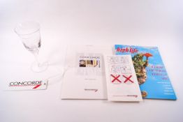 A collection of Concorde memorabilia, including a wine glass from 1995 Anniversary flight to London,