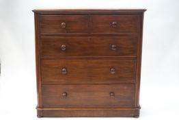 A Victorian mahogany chest of two short and three long graduated drawers with turned handles,