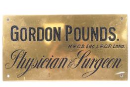 A brass Physician & Surgeon sign for Gordon Pounds, 18cm x 33.