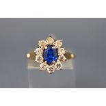 A 1960's 9ct gold, blue and colourless stone oval cluster ring, London 1967, size N+, 3.