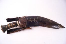 A Kukri with brass mounted horn handle,