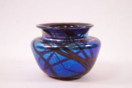 A Studio glass vase by Siddy Langley, linear design to a blue lustre ground,