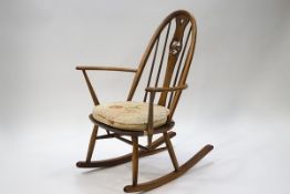 An Ercol stick back rocking chair,