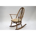 An Ercol stick back rocking chair,