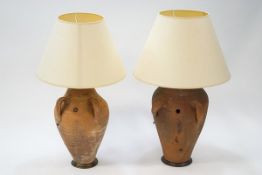 Two terracotta two handled vases converted to table lamps,