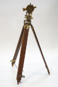 An early 20th century brass precision surveying level on tripod by F.W.