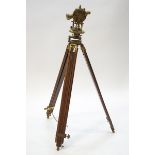 An early 20th century brass precision surveying level on tripod by F.W.